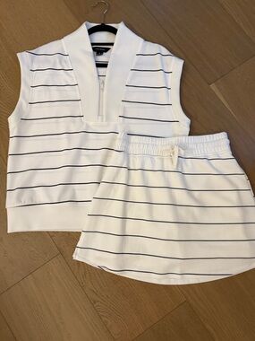 Cream Sleeveless Zip Polo Top and Matching Skort with black Stripes